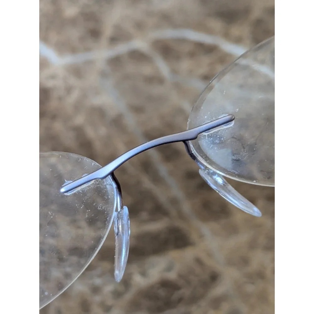 Silhouette Eyeglasses 4476 40 6053 52[]17 135 5416 Titan Creme Rimless Austria